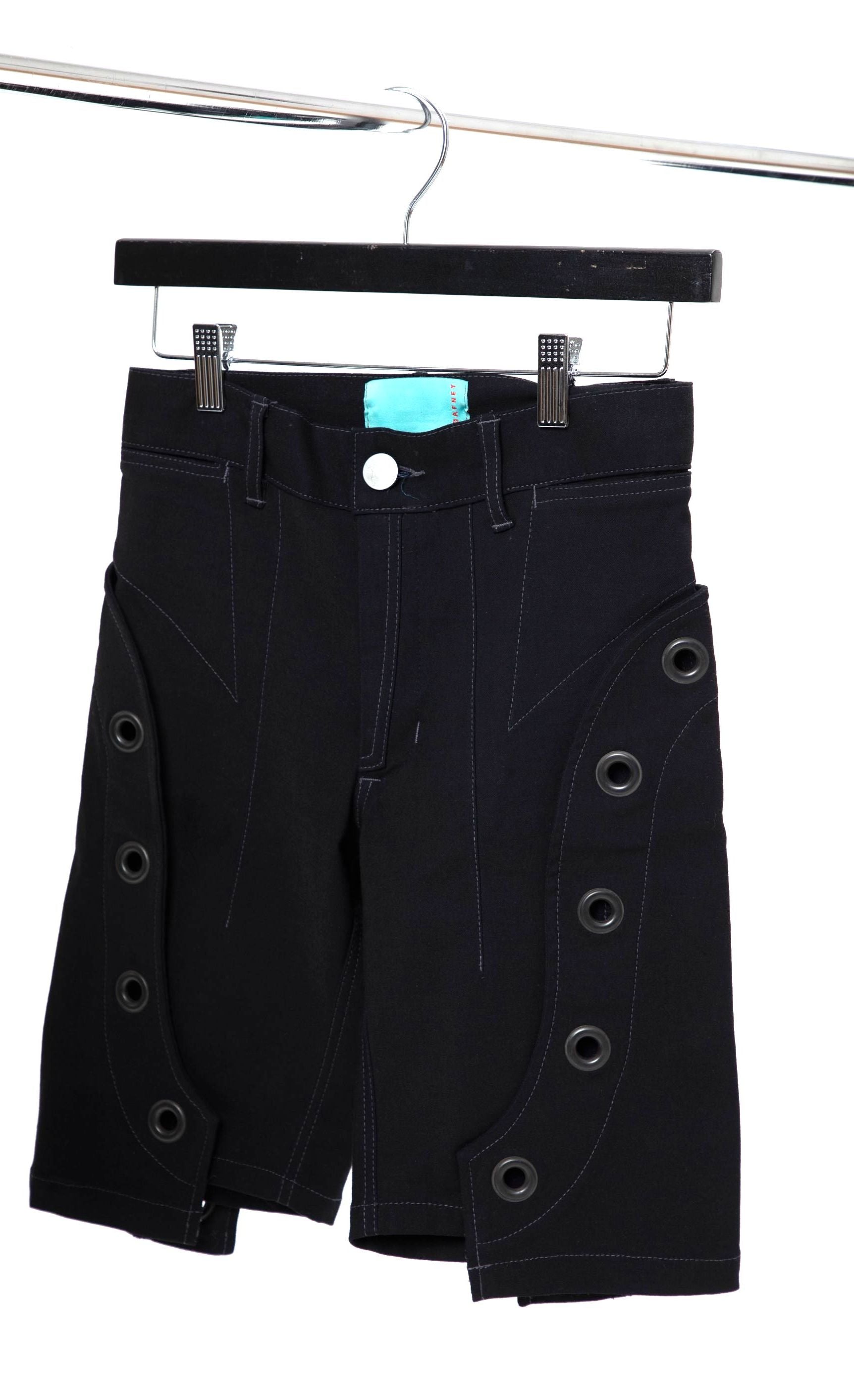 The black denim Diablo shorts displayed on a hanger