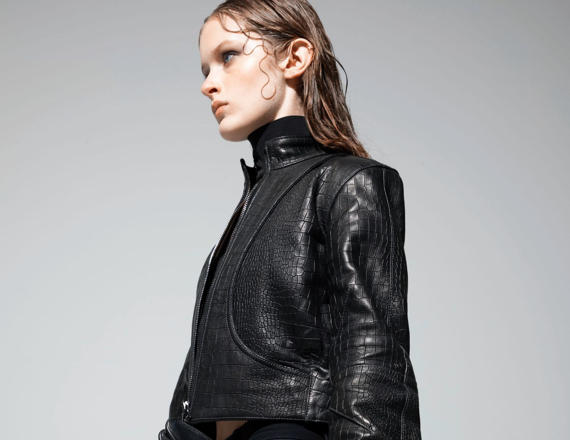Close view of the crocodile-embossed Orca leather jacket